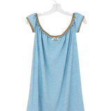 A light blue sleeveless top with ruffled trim and lace-up shoulder details, hanging on a clear plastic hanger against a white background.
