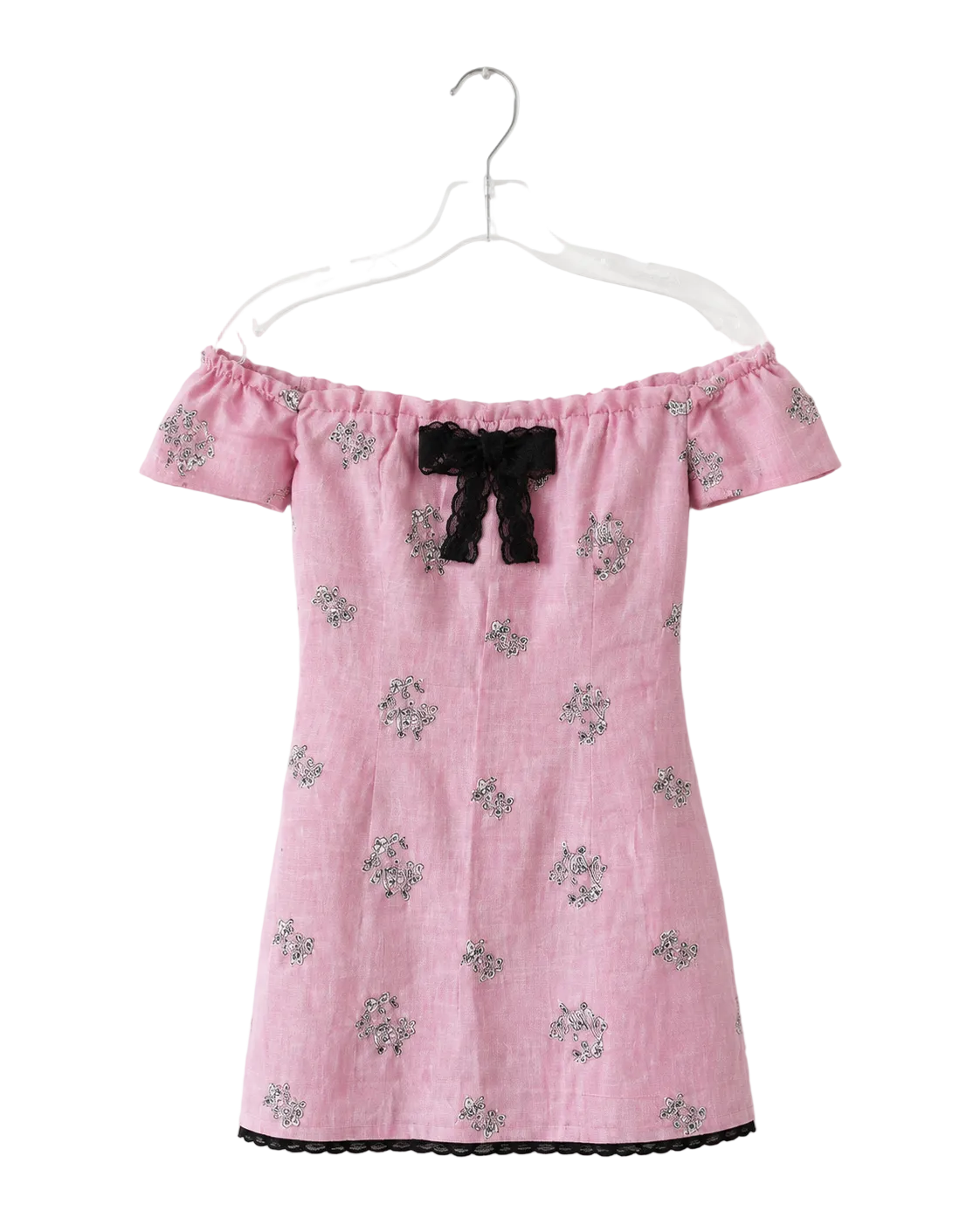 A pink off-the-shoulder dress with a black bow at the neckline and small floral embroidery, hanging on a clear plastic hanger against a white background.