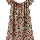 A short dress with a red and green floral print on a beige background, featuring ruffled cap sleeves and a white lace-trimmed scoop neckline, shown against a plain white background.