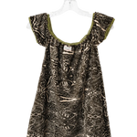 A short-sleeve babydoll dress with an abstract black and beige pattern, featuring olive green trim along the scoop neckline, hanging on a clear plastic hanger against a white background.