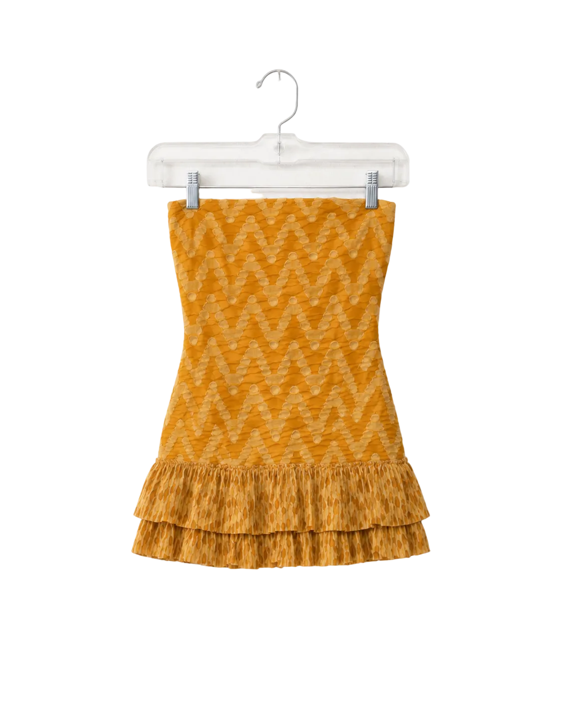 A yellow-orange knit strapless top with a zigzag pattern and a ruffled hem, hanging on a clear plastic hanger against a white background.