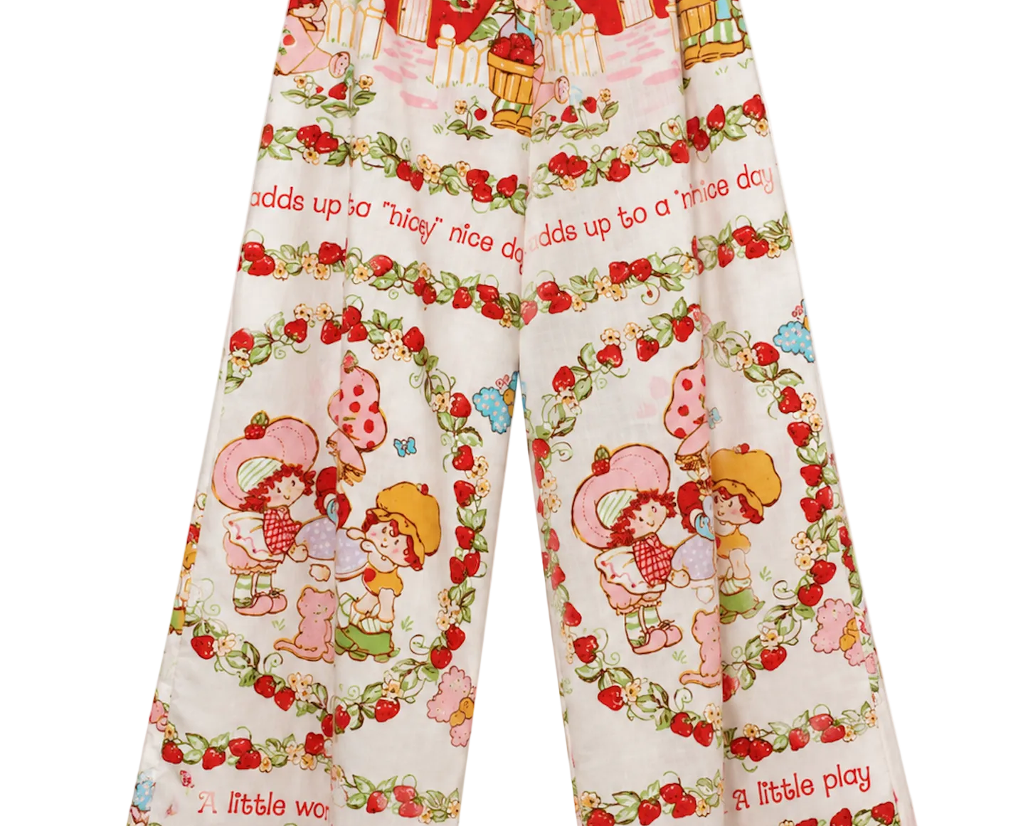A pair of 1983 wide-leg cropped pants featuring a colorful Strawberry Shortcake-themed print with red strawberries, cartoon characters, and text on a cream background.