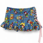 The Rag Doll Ruffle Mini - front view showing yellow bow and pink lace-up side detail