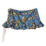 The Rag Doll Ruffle Mini - back view showing ruffled hem and clean print