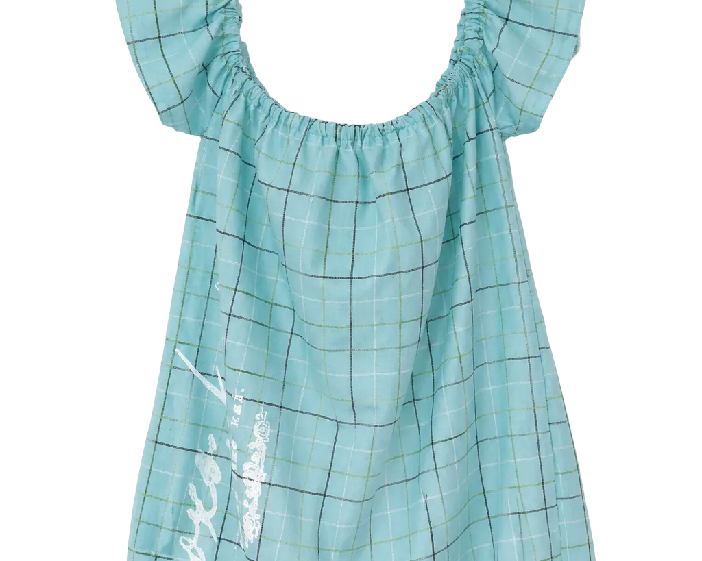 A light blue-green plaid baby dress with ruffled off-the-shoulder sleeves and white script embroidery on the front, hanging on a clear plastic hanger against a white background.